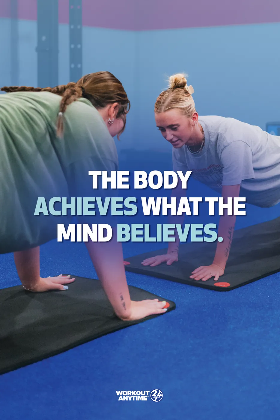 Workout Anytime poster: two women stretching on a mat under the line The body achieves what the mind believes.