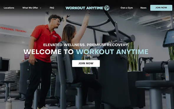 Workout Anytime corporate website homepage: a trainer coaching a member on a machine under the headline Welcome to Workout Anytime, with a Join Now button.